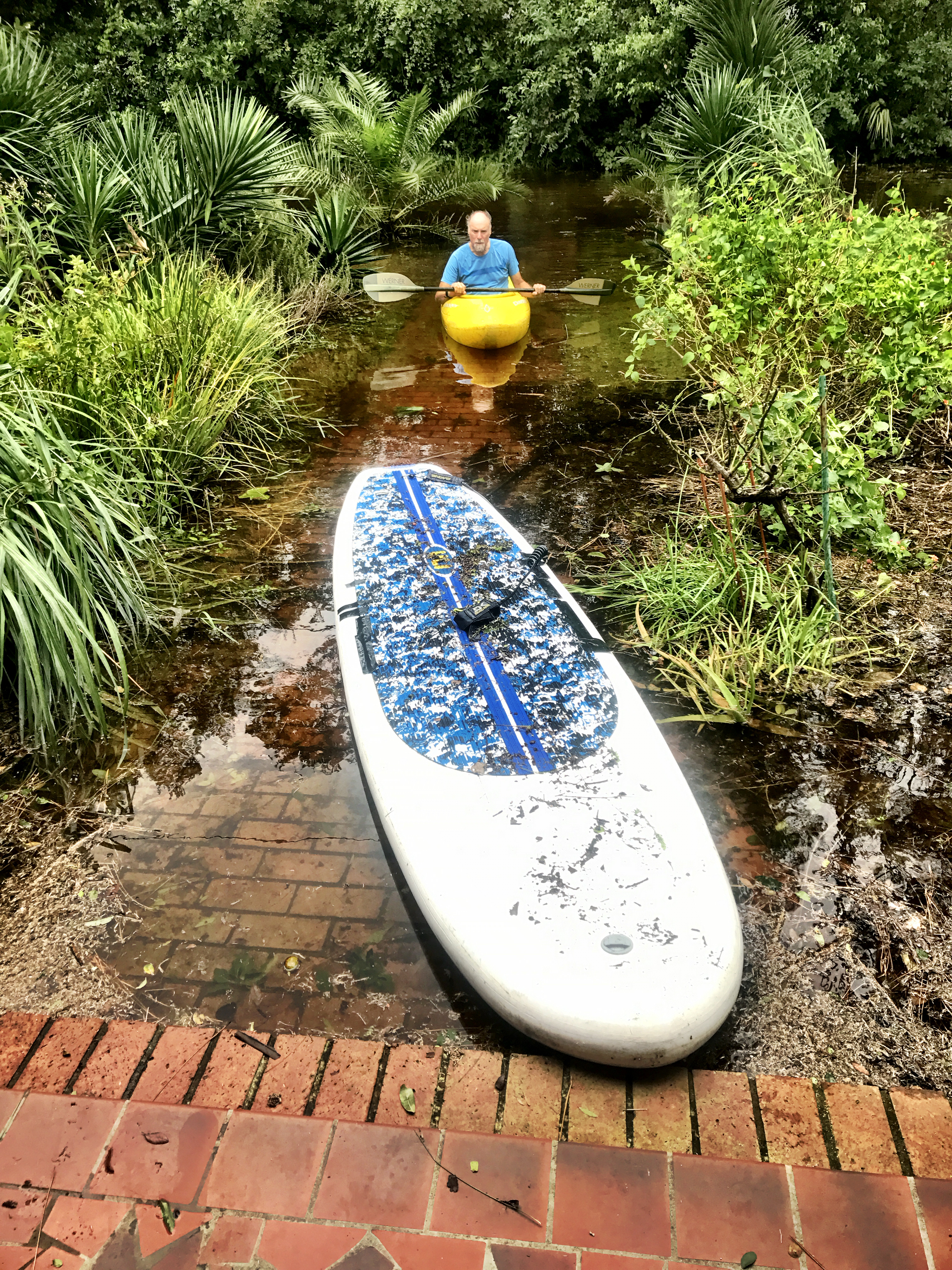 kayak and paddleboard on front walk